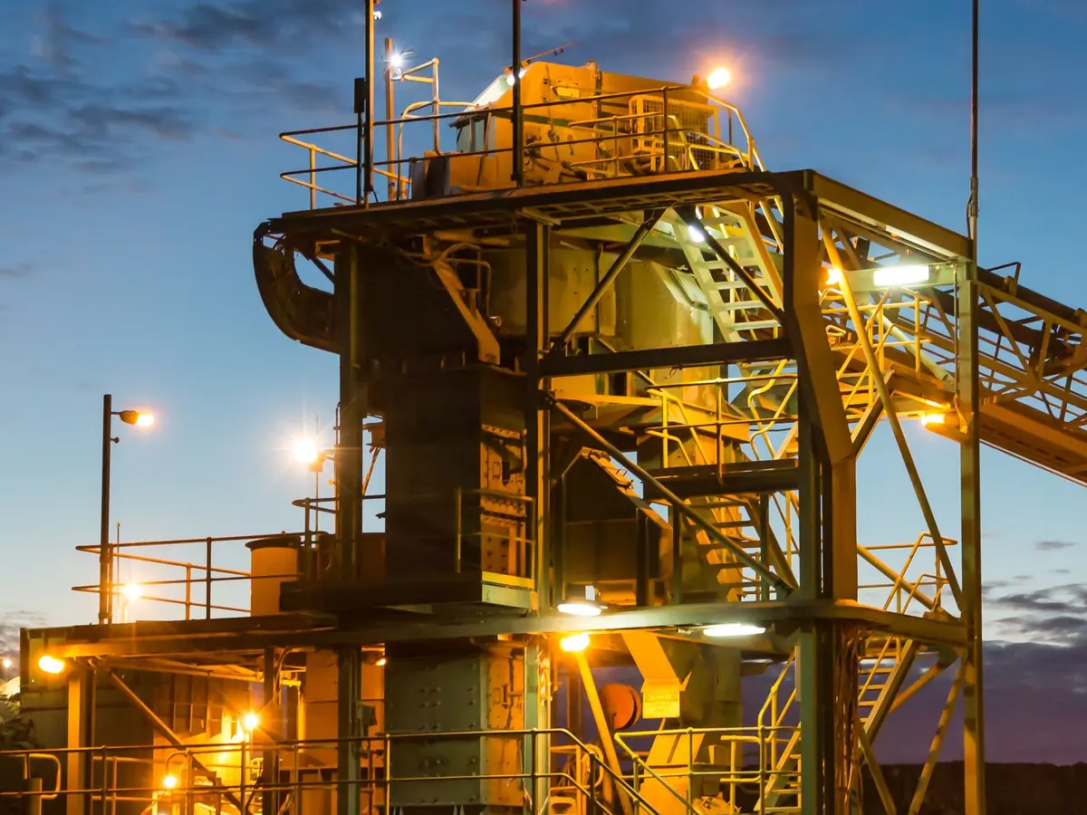 Bulk materials transfer station and conveyors at dusk